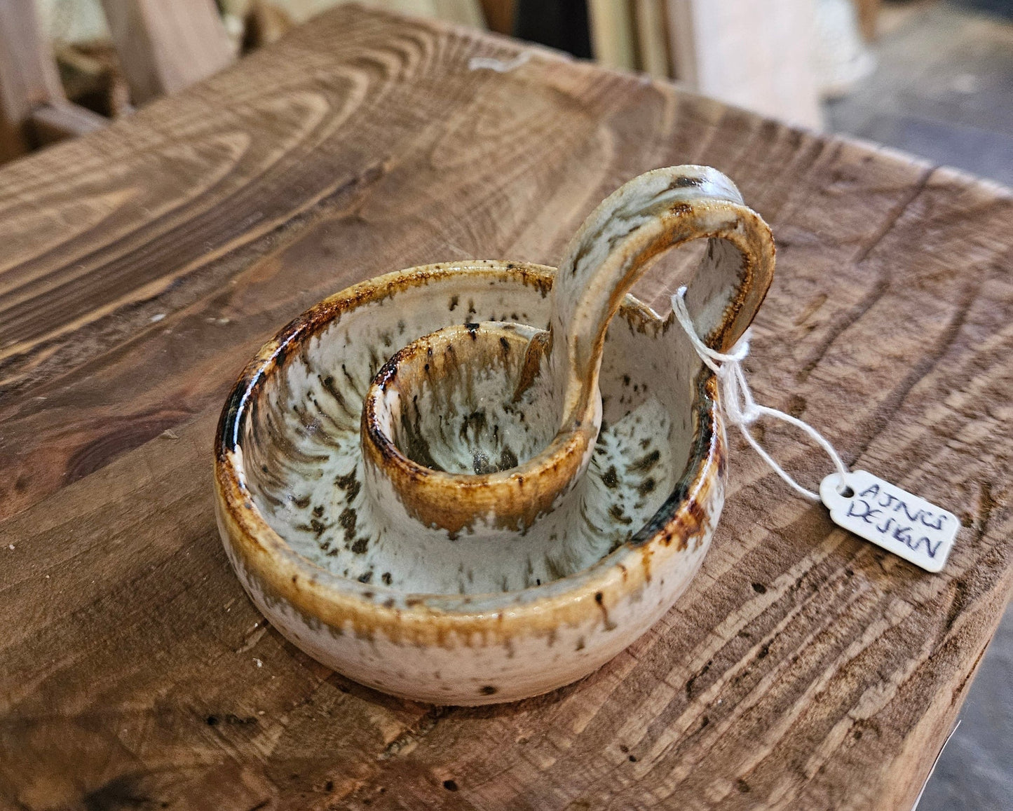 splatter design candle holder on wooden rustic Cotswolds interior surface
